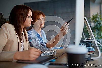 Teamwork in the graphic designer studio Stock Photo