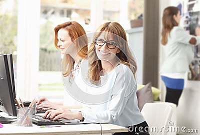 Teamwork at modern graphic design studio Stock Photo