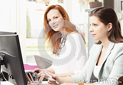 Teamwork at modern graphic design studio Stock Photo