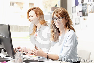 Teamwork at modern graphic studio Stock Photo