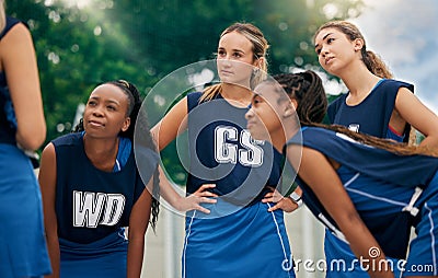 Teamwork, netball and women in a huddle for motivation, team building and planning a strategy in a sports game. Fitness Stock Photo