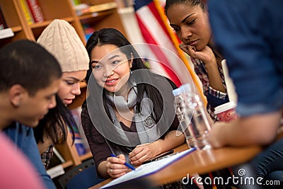 Teamwork of students working on task together Stock Photo