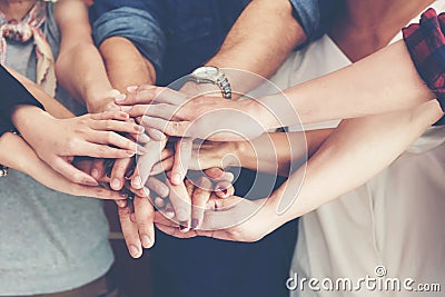 Teamwork Success. Top view executive business people group team happy showing teamwork and joining hands or giving five after mee Stock Photo