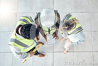 Teamwork, tablet or engineer construction workers working, collaboration on building project at construction site. Above Stock Photo