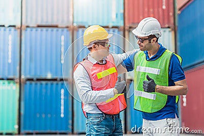 Teamwork of worker working good thumbs up together Happy smiling in Logistic segment container loading area cargo port Stock Photo