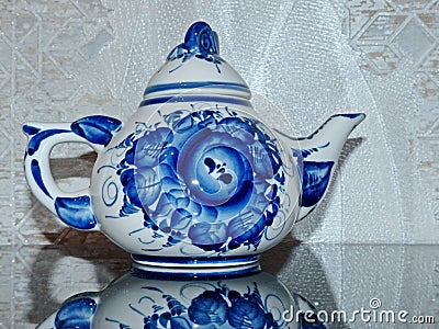 Teapot. Home tableware in Russian traditional Gzhel style. Closeup. Gzhel - Russian folk craft of ceramics Stock Photo