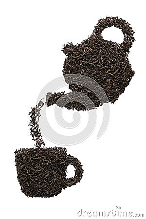 Teapot pouring tea into a cup. Silhouette made of dry black tea Stock Photo