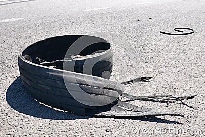 Tear rubber truck tire on asphalt road highway Stock Photo