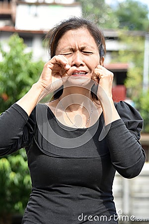 A Tearful Female Senior Granny Stock Photo