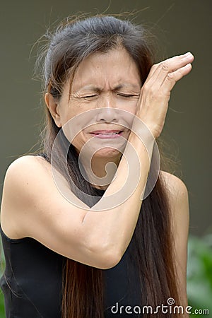 Tearful Retired Minority Female Senior Stock Photo