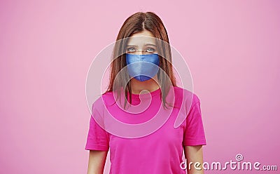 Tearful woman wearing facemask, isolated Stock Photo