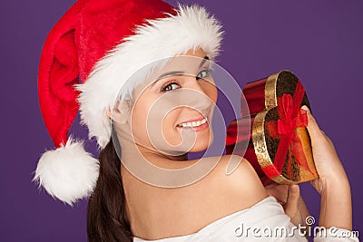 Teasing woman with a Christmas gift Stock Photo