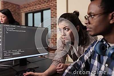 Tech enginner asking app designer for help with html code, Stock Photo