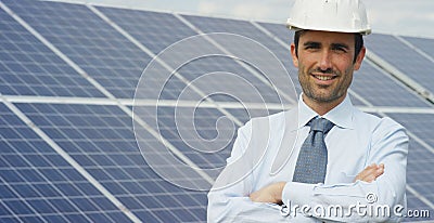 Technical expert in solar energy photovoltaic panels, remote control performs routine actions for system monitoring using clean, r Stock Photo