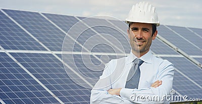 Technical expert in solar energy photovoltaic panels, remote control performs routine actions for system monitoring using clean, r Stock Photo