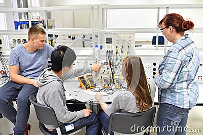 Technical vocational training in industry: young apprentices and Stock Photo