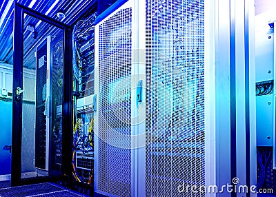 Technical wall of cellular data terminal rows with opened mesh door. modern data center blue toning Stock Photo