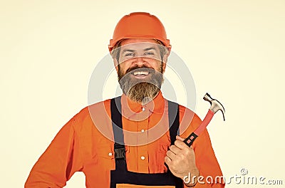 Technical work. Bearded mature man in uniform. Guy with hammer. Good hammer. Almost every household has hammer. Estimate Stock Photo
