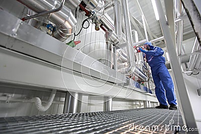 Technician controlling technological system Stock Photo