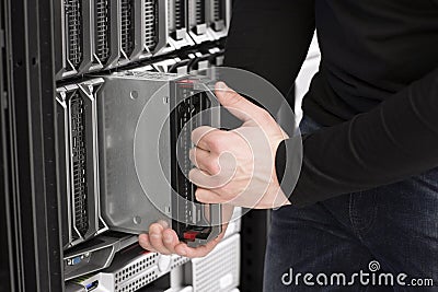 IT Engineer installs Blade Server in Data Center Stock Photo