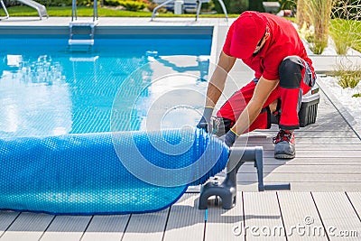 Technician Finishing Pool Deck Installation Stock Photo