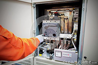 Technician , hand of electrician push open the air circuit break Stock Photo