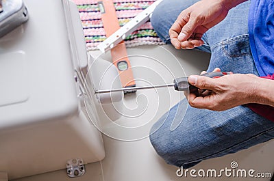 Technician hand using screwdriver to outdoor unit of air conditi Stock Photo