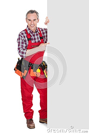 Technician holding blank placard Stock Photo