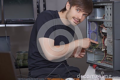 Technician installing new hardware Stock Photo