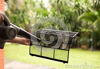 Technician man dry up and dust cleaning air Conditioner filter w Stock Photo