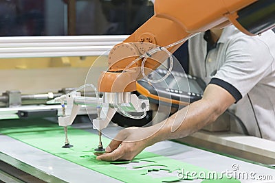 The technician operator adjust the automatic robot Stock Photo