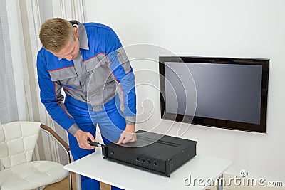 Technician repairing amplifier Stock Photo