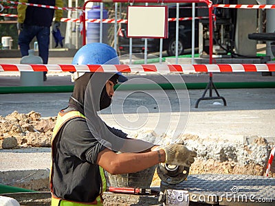 Technician repairing maintenance fuel pipe underground stati Editorial Stock Photo