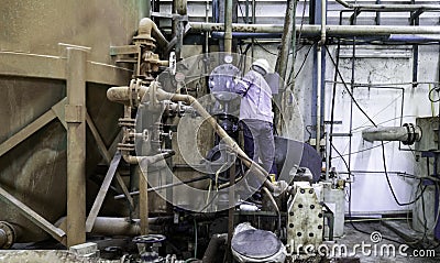 Technician are reparing breakdown machine in factory Stock Photo