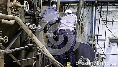 Technician are reparing breakdown machine in factory Stock Photo