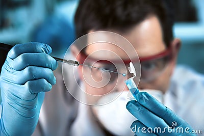 Technician researcher sampling pcr tube for genetic analytical in the clinical laboratory Stock Photo