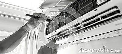 A technician's hands carefully work on an air conditioner unit, utilizing tools to ensure its proper function Stock Photo