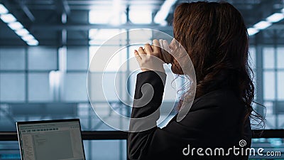 Technician using laptop in data center, finetuning network protocols Stock Photo