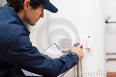 Technician at work adjusting a regulator Stock Photo