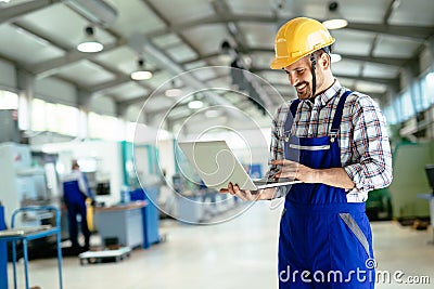 Technician working in factory and doing quality control Stock Photo