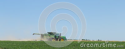 Technician works in the field for the harvest Editorial Stock Photo