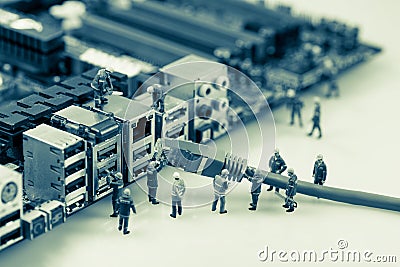 Technicians connecting network cable to motherboard Stock Photo