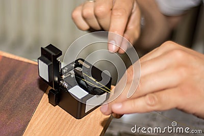 Cutting and Splicing: Technicians Ensuring Modern and Fast Internet Connectivity Stock Photo