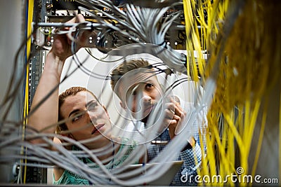 Technicians fixing cable Stock Photo