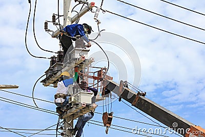 Technicians Working on Electrical Pole Stock Photo