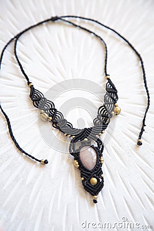 technique waxed string necklace with gemstone rose quartz Stock Photo