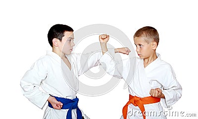 Techniques blows and protection training sportsmen in a kimono Stock Photo