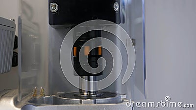Technological background with a part of a fast rotating mechanism. HDR. Close up of spinning metal tube of an automatic Stock Photo