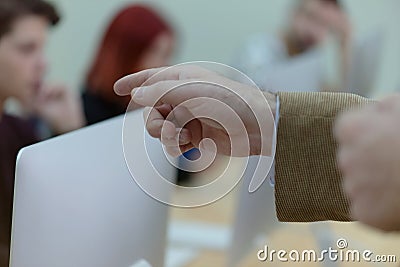 IT technologies teacher at work. IT professor explain lesson to multietchnic students. Professor`s hand with gesture Stock Photo