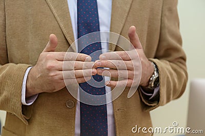 IT technologies teacher at work. IT professor explain lesson to multietchnic students. Professor`s hand with gesture Stock Photo